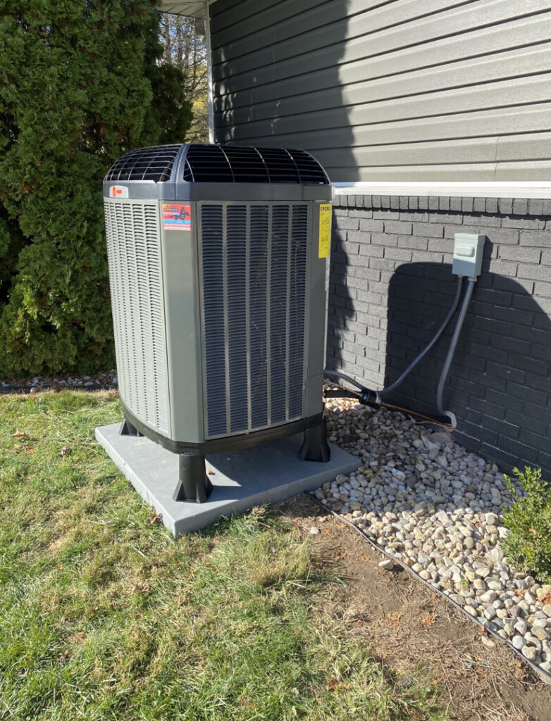 A newly installed Trane outdoor air conditioning unit by Roy Rogers Heating and Air in Indianapolis, IN.