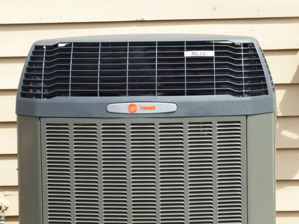 A close-up view of a Trane XL18i air conditioner, serviced by Extreme Heating and Cooling II - Indiana in Westfield, IN.