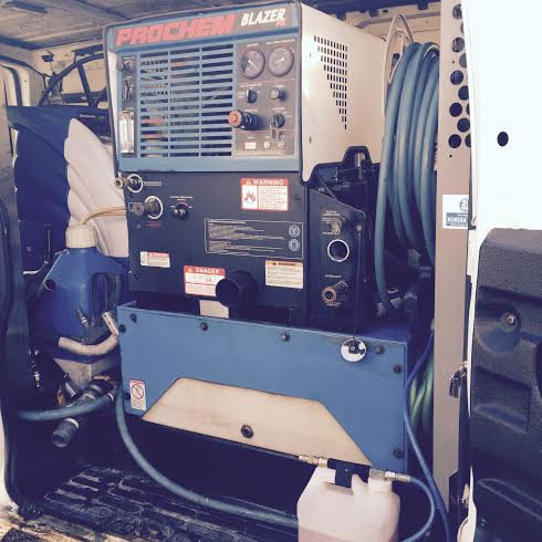 A Prochem Blazer truck-mounted carpet cleaning machine inside a Celtic Carpet Cleaner van in Fort Lauderdale, FL.