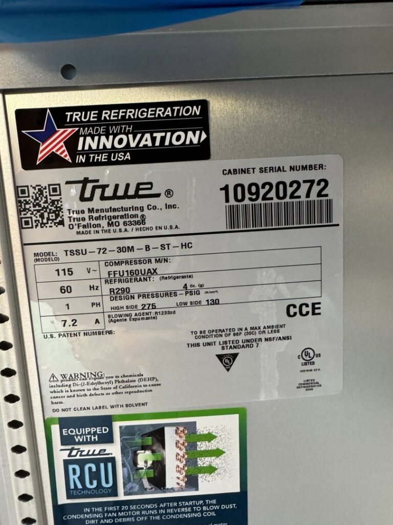 A close-up of a True Refrigeration unit's specification label, indicating service by Setpoint Refrigeration LLC in Liberty Hill, TX