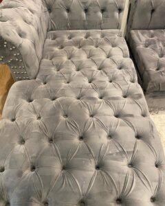 A tufted chaise lounge showing cleaning marks after upholstery cleaning by Carpet Kingz in Houston, TX
