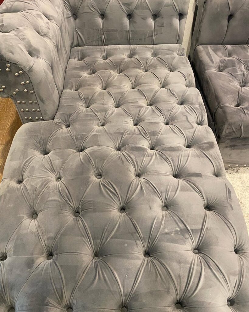 A tufted chaise lounge showing cleaning marks after upholstery cleaning by Carpet Kingz in Houston, TX