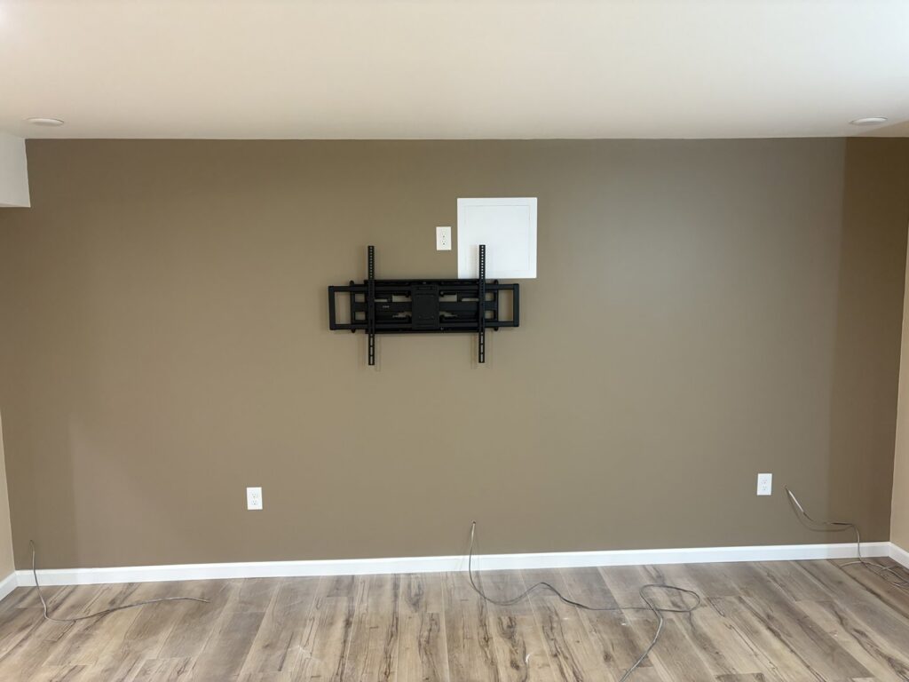 TV mount and electrical outlet installation with wiring for entertainment systems by The Dorky Electrician, LLC in Coplay, PA