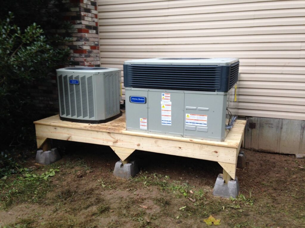 Two American Standard outdoor HVAC units installed on a wooden platform by Eastern Air Flow of Kentucky in Richmond, KY.