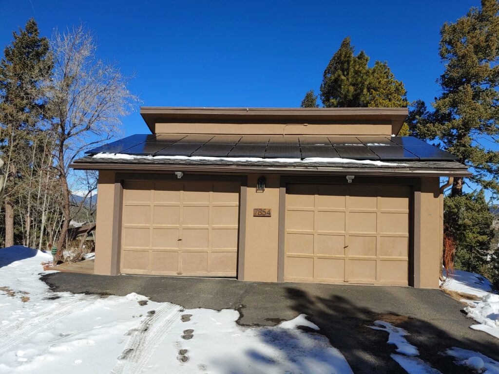 Residential installation of two brown garage doors by Colorado Garage Door Pro's in Denver, CO
