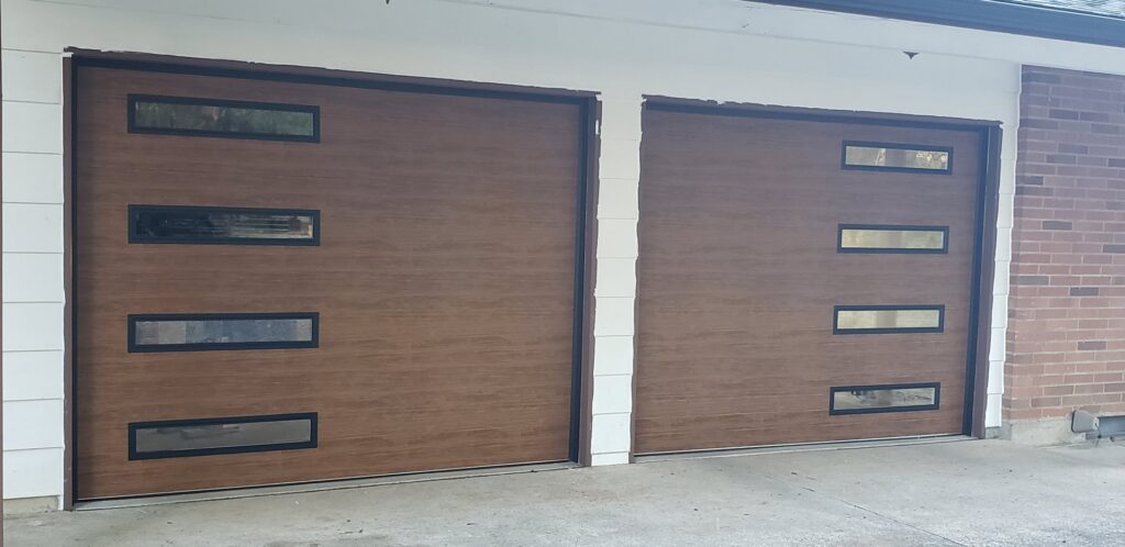 Two modern brown garage doors with horizontal panels and multiple windows, installed by Coast To Coast Garage Door LLC in Vancouver, WA.