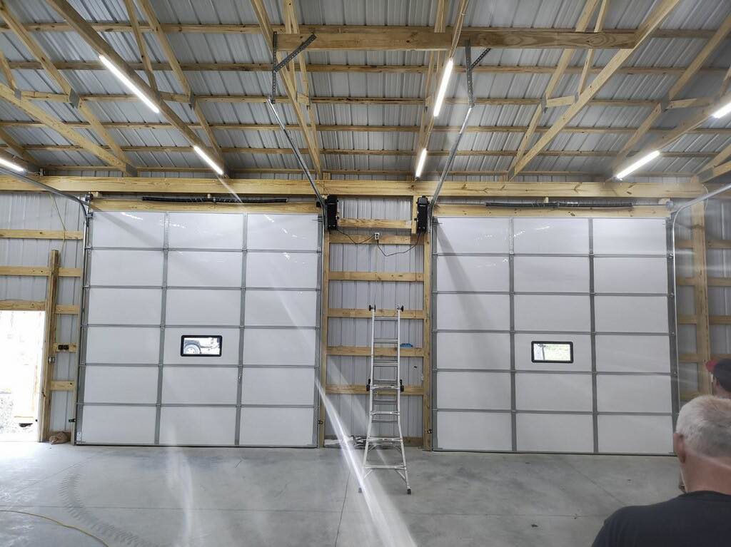 Interior view of two commercial garage door installations by Horton & Hill Garage Door Specialists LLC in Sapulpa, OK.