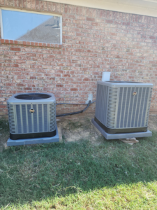 Two Goodman outdoor air conditioning condenser units installed by Smith Heat an Air, LLC in Southaven, MS.