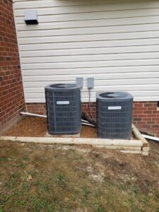 Two Goodman outdoor HVAC units recently installed by Booker Heating & Air in Richmond, VA.