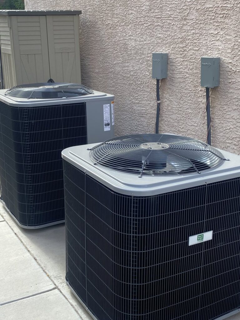 Two outdoor HVAC condenser units installed or serviced by Instant Air in Las Vegas, NV.