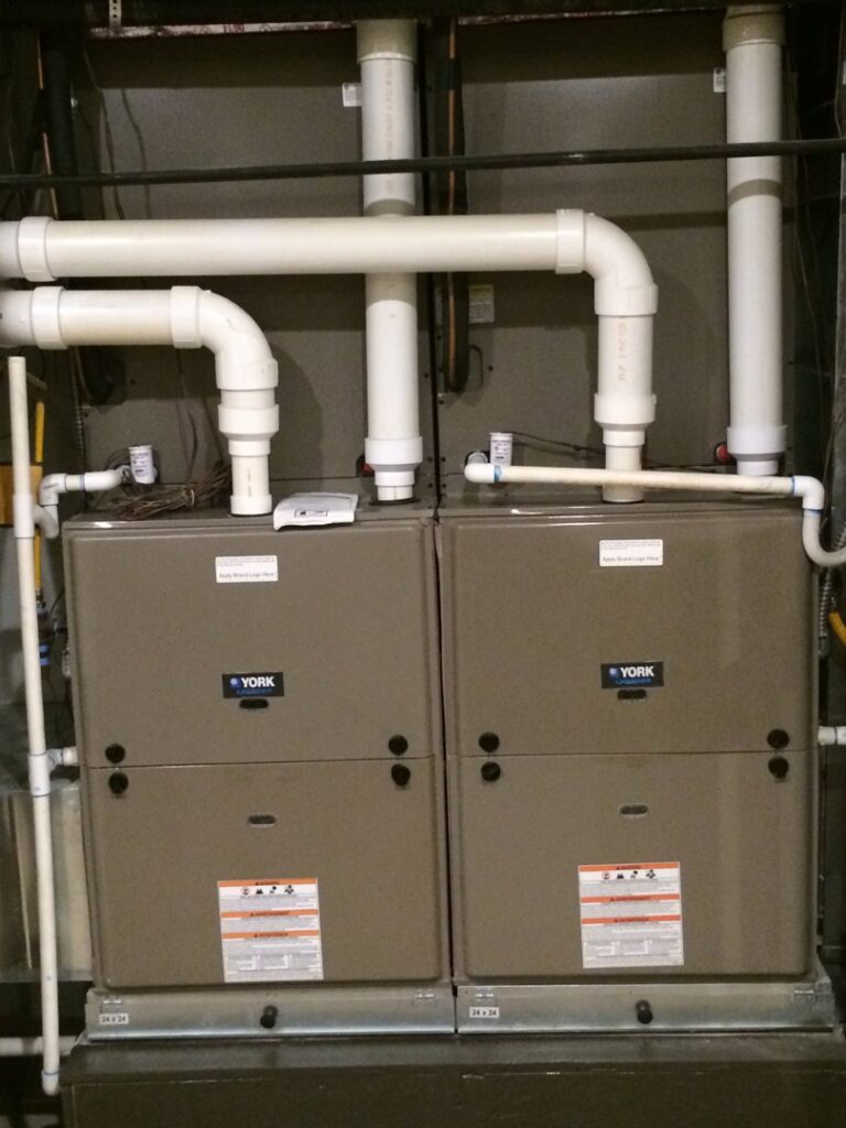 Two indoor furnace and air handler units installed by Vision Air Services in Tulsa, OK.