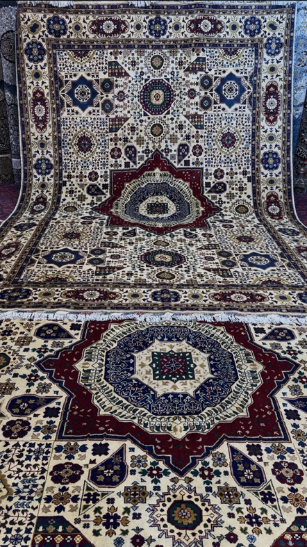 Two intricately patterned carpets showcased on display by Mawr Store, a carpet contractor in Chaman-e-Hozori, Kabul, AF