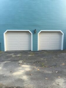 Two light beige panel garage doors installed by Snowbird Garage Doors Company in Worcester, MA.