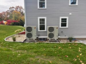 Two Mitsubishi Electric outdoor mini-split HVAC units installed by A&A Mechanical HVAC in Raynham, MA.