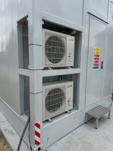 Two Mitsubishi Electric mini-split outdoor units installed on a building by Boise Valley Heating & Air in Meridian, ID