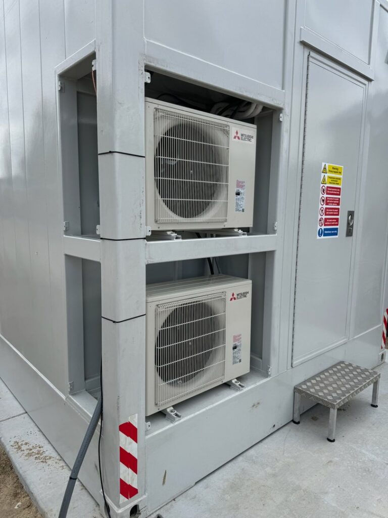 Two Mitsubishi Electric mini-split outdoor units installed on a building by Boise Valley Heating & Air in Meridian, ID
