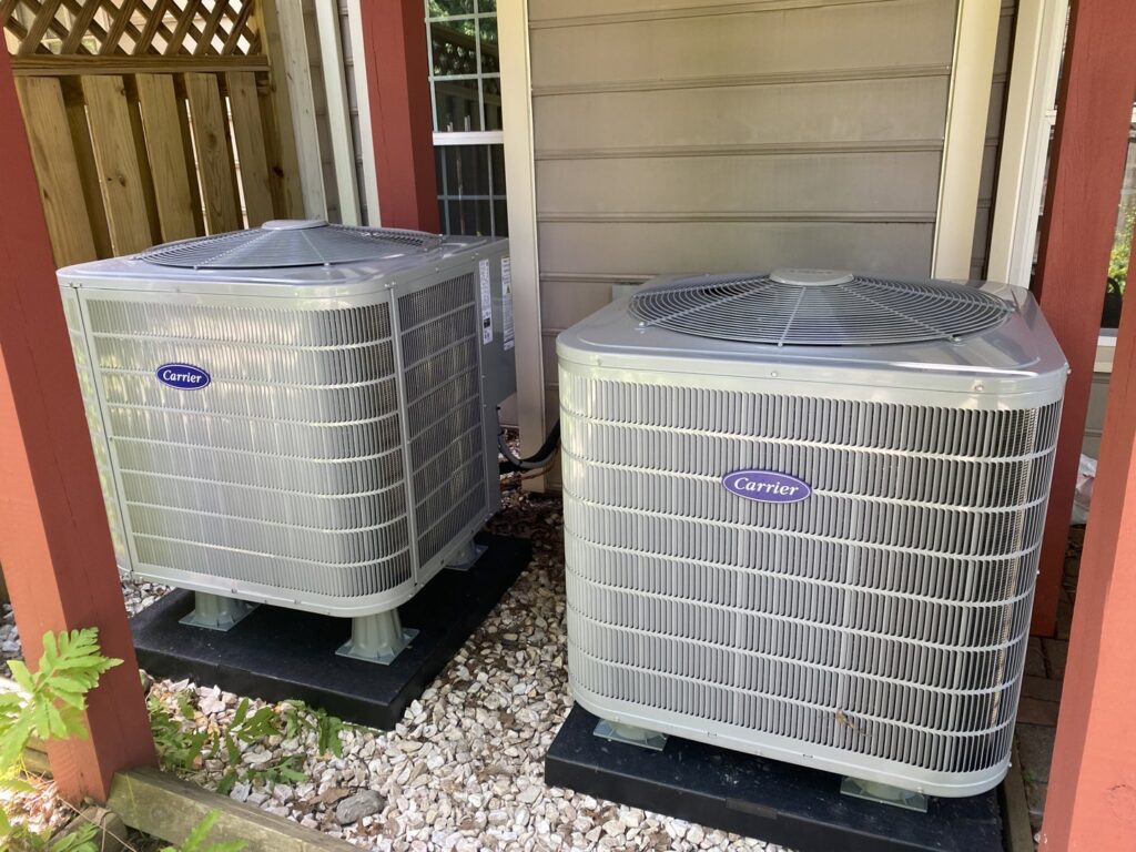 Two newly installed Carrier outdoor AC units by Residential Express Heating & Air in Sterling, VA.