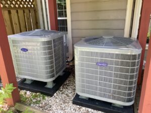 Two newly installed Carrier outdoor AC units by Residential Express Heating & Air in Sterling, VA.