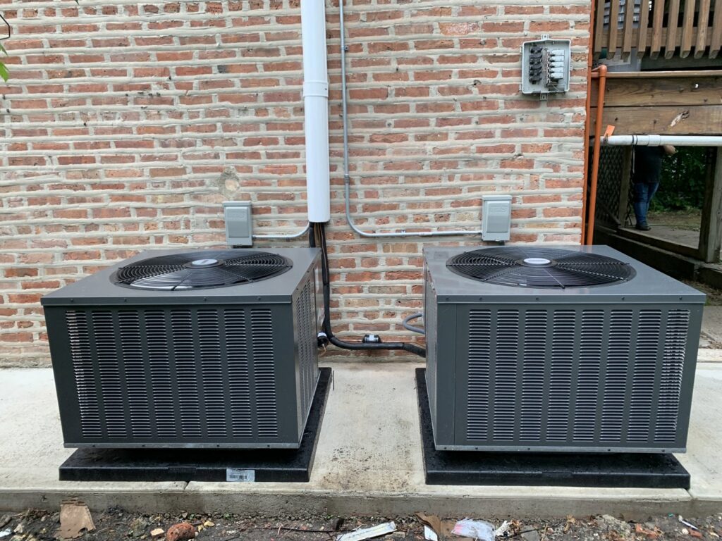 Two new outdoor air conditioning units installed by Hvac Buddies in Chicago, IL