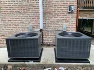 Two new outdoor air conditioning units installed by Hvac Buddies in Chicago, IL