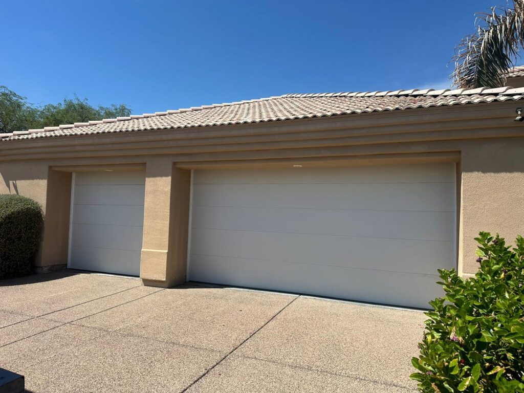 Two modern residential garage doors recently installed or repaired by Central Garage Door Repair LLC in Glendale, AZ.