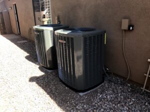 Two outdoor air conditioning condenser units installed by A+ Air and Aeroseal in Scottsdale, AZ.