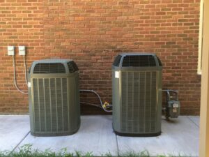 Two outdoor air conditioning condenser units installed by Vision Air Services in Tulsa, OK.