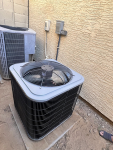 Two outdoor AC condenser units installed by Weather Masters, Inc. in Mesa, AZ.