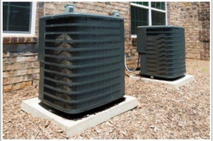 Two outdoor air conditioning units installed by All Comfort Air Heating and Air Conditioning in Raleigh, NC.
