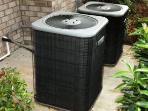 Two outdoor AC units (condensers) installed by Brimhall Maintenance Services in Cordova, TN