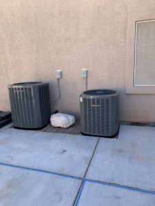 Two outdoor air conditioning units installed by Dakine Heating & Cooling, LLC in Las Vegas, NV.