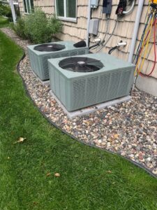 Two outdoor air conditioning units installed side-by-side by HVAC KING LLC in Maple Grove, MN