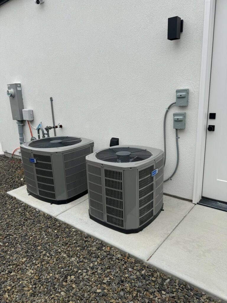 Two newly installed outdoor AC units for a home by Boise Valley Heating & Air in Meridian, ID