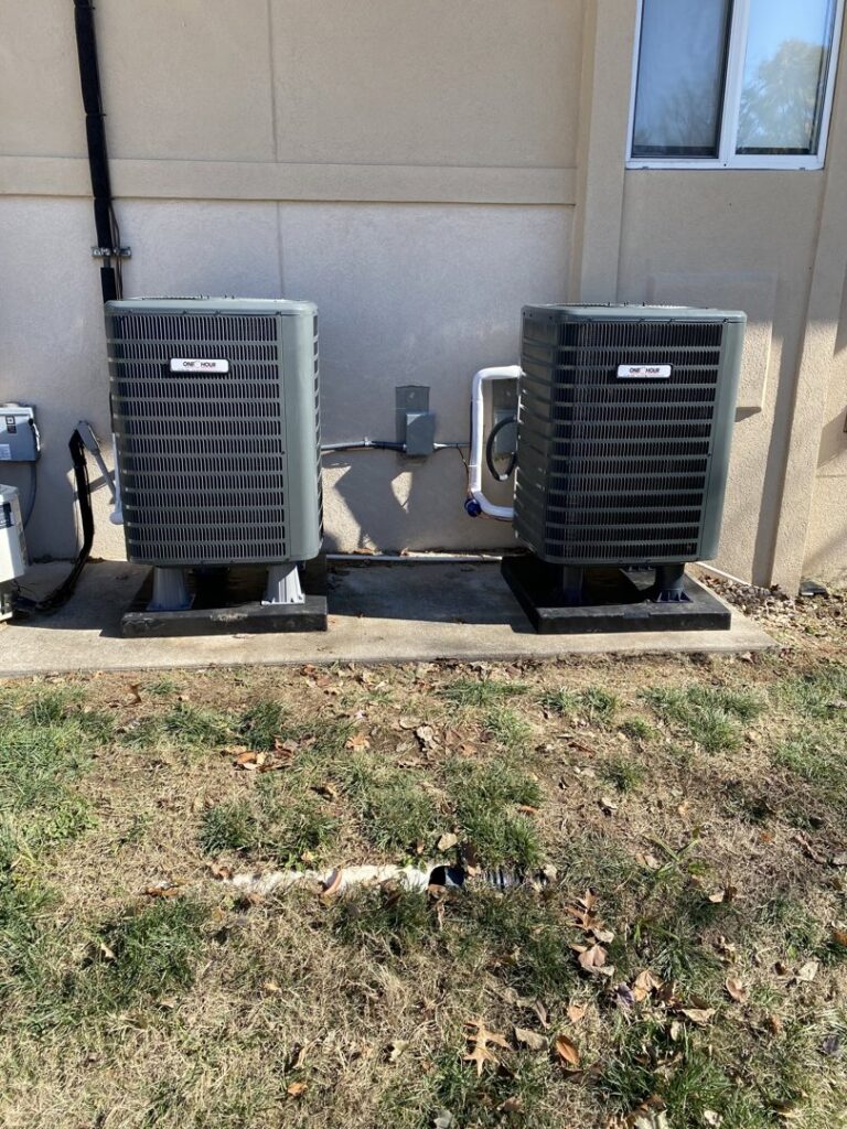 Two outdoor AC units, serviced or installed by One Hour Heating & Air Conditioning of Springfield in Springfield, MO.