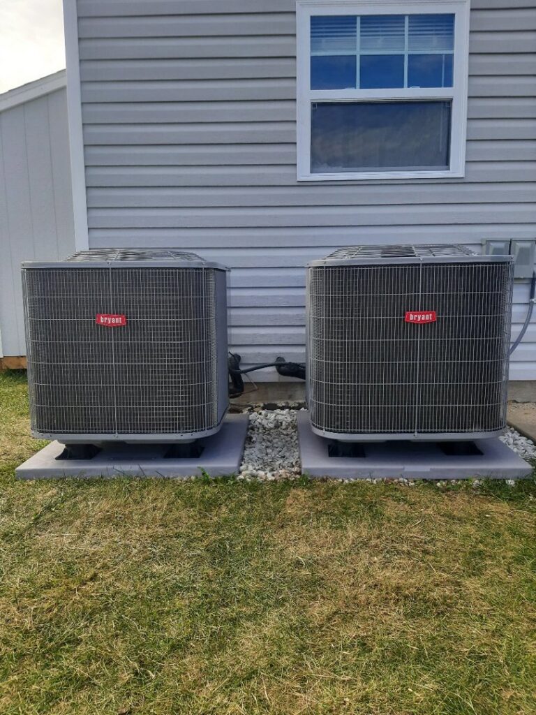 Two outdoor Bryant HVAC units installed side-by-side by Madison HVAC/R, Inc in Richmond, KY.