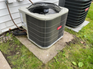 Two outdoor HVAC condenser units, including a Bryant unit, installed by Bowmans Heating and Air LLC in Middletown, KY