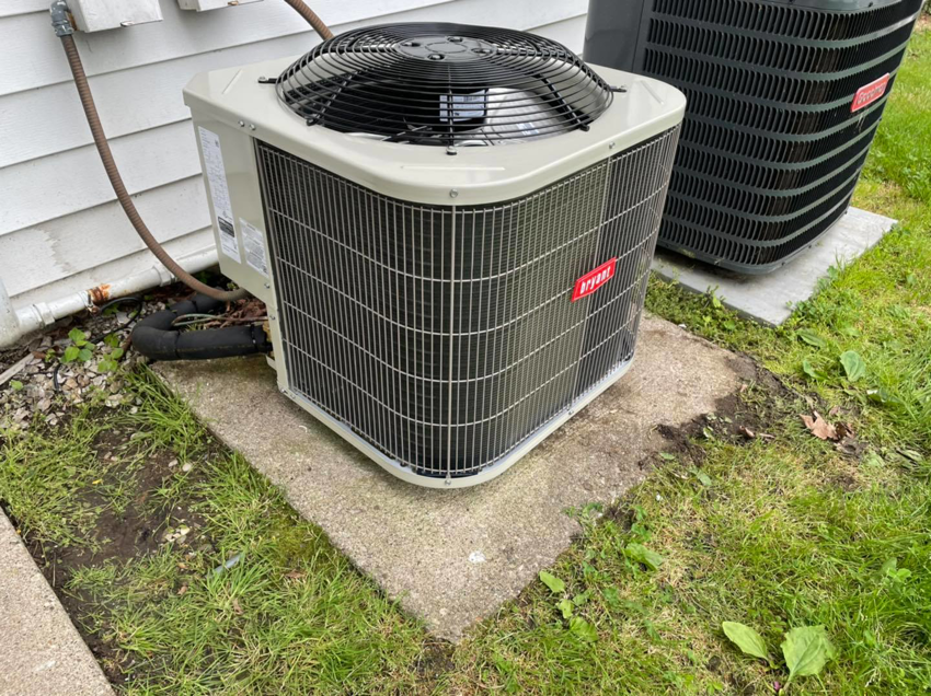 Two outdoor HVAC condenser units, including a Bryant unit, installed by Bowmans Heating and Air LLC in Middletown, KY