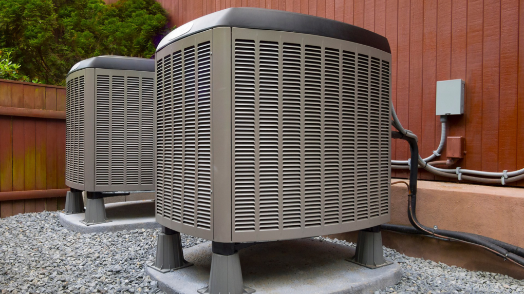 Two outdoor HVAC condenser units installed by Pioneer Heating and Cooling in Kalispell, MT