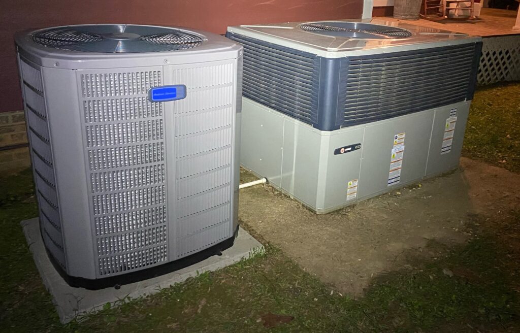 Two outdoor HVAC units, an American Standard and a Trane, installed side-by-side by A/C Company Since 1988 in Murfreesboro, TN.