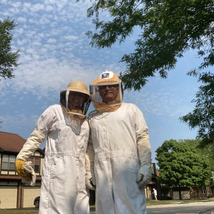 Two ABG Pest Control services technicians in protective suits ready for a job in West Chicago, IL.
