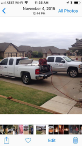 Two pest control trucks with equipment ready for a job by Roach's Termite Service Inc. in Oklahoma City, OK