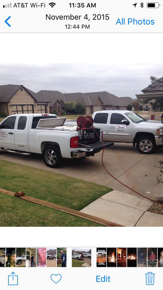 Two pest control trucks with equipment ready for a job by Roach's Termite Service Inc. in Oklahoma City, OK