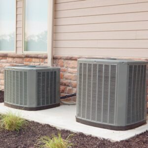 Two residential outdoor air conditioning units installed by Honesty Services in Rock Hill, SC.