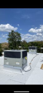 Two newly installed rooftop HVAC units on a commercial building by Uplifting Air, LLC in San Antonio, FL.
