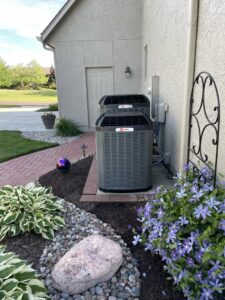 Two Trane XR outdoor AC units professionally installed by A-Team PHC at a residence in Olathe, KS.