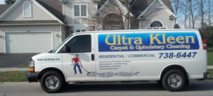 The Ultra Kleen Carpet & Upholstery Cleaning service van parked in Spencerport, NY, ready for a job.