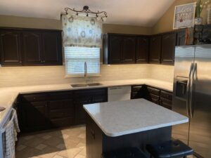 Kitchen with new under-cabinet lighting and a ceiling light fixture installed by In the Light Electrical LLC in Kansas City, KS