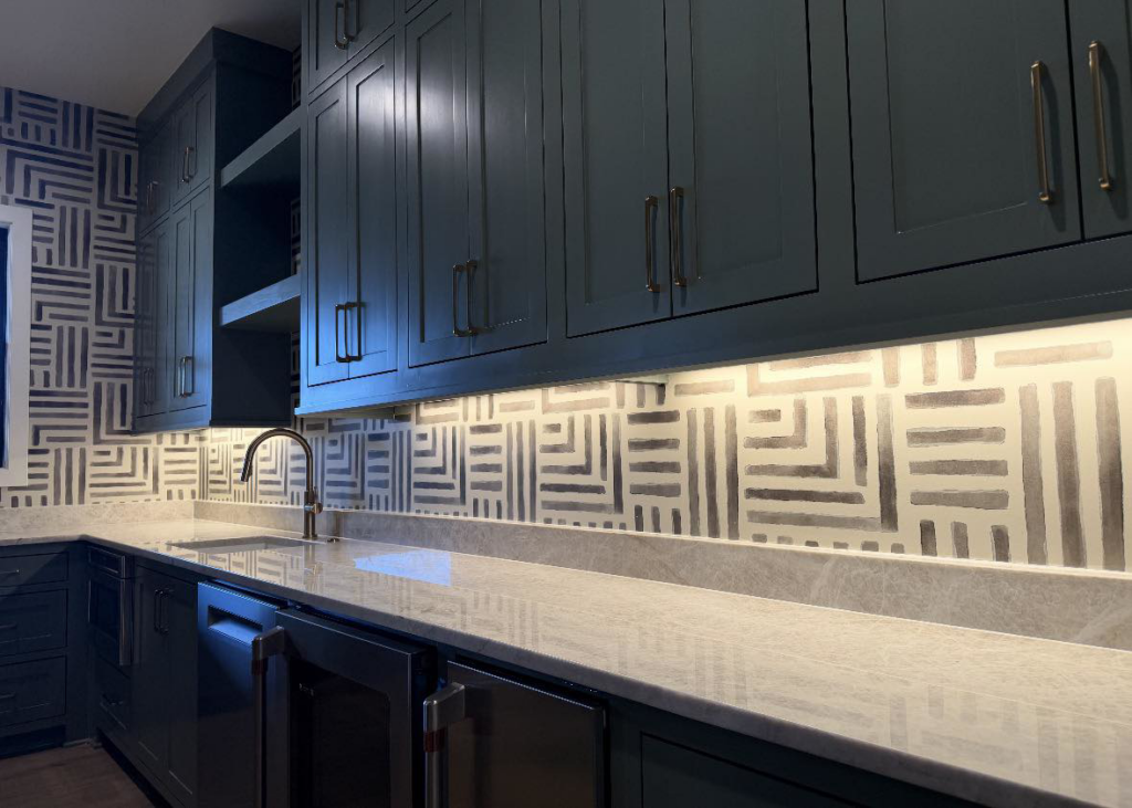 Bright under-cabinet lighting installed in a kitchen or bar area by HMH Electric, providing services in Fayetteville, AR.