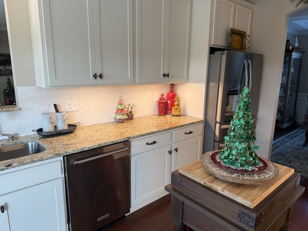 Under-cabinet lighting installed in a modern kitchen by Power'd Up Electric, LLC in Clinton, TN.