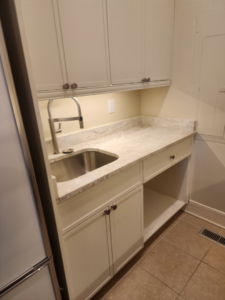 Under-cabinet lighting and electrical outlet installed in a kitchen by D&R Construction & Electrical Services in Summerville, SC.